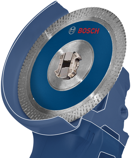 附有圆锯片的蓝色角磨机的特写。.