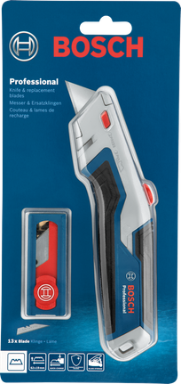 蓝色背景上的塑料包装美工刀和备用刀片。